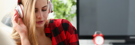 woman work on laptop listen music headphonesの写真素材