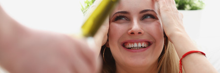 woman take bottle of wine unhealthy way of lifeの写真素材