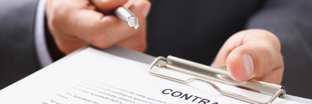 Male arm in suit offer contract form onの写真素材