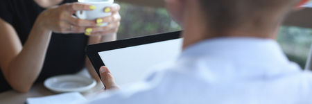 young beautiful man and woman meet in cafe businessの写真素材