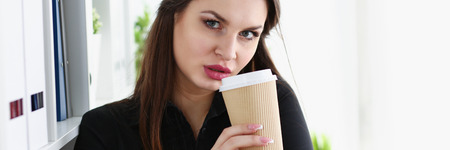 Businesswoman at workplace in office portraitの写真素材