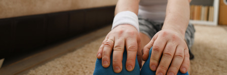 Young attractive fitness man lies on a fat mat withの写真素材