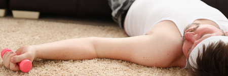 A young man was engaged in fitness at homeの写真素材