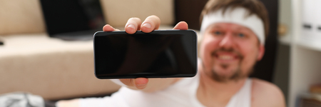 A young cute fat man with overweight doesの写真素材