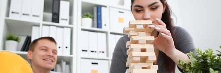 Businessman plays in a strategy of block puzzleの写真素材