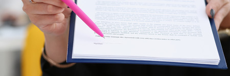Female arm offer contract form on clipboard pad