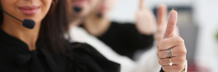 Three call centre service operators arm show OKの写真素材