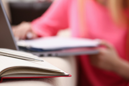 woman study hard write down information to notebook education conceptの写真素材