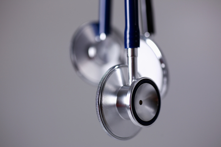 Heads of a stethoscope on a grayの写真素材