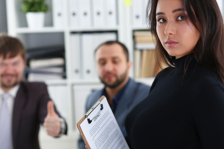 young happy businessmen have meeting in office discuss issuesの写真素材