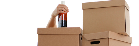 Specialist courier delivery service against the backdrop of boxesの写真素材