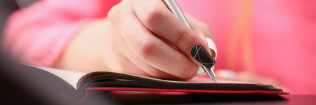 woman study hard write down information to notebookの写真素材