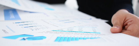 businesswoman study documents in office closeup