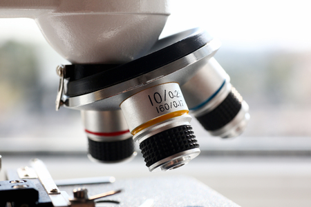 The head microscope on the blurred background.の写真素材