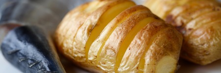 Baked golden potatoes with herring mackerel