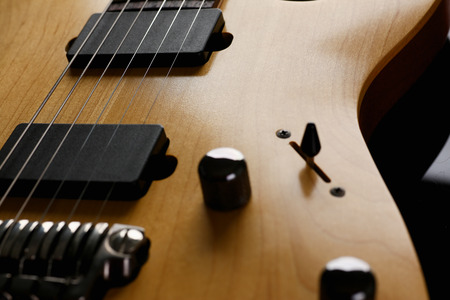 Classic shape wooden electric guitar with rosewood neck
