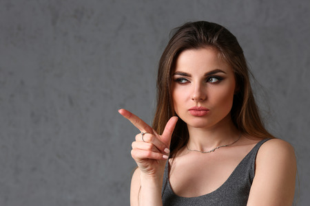 A caucasian woman on a gray backgroundの写真素材