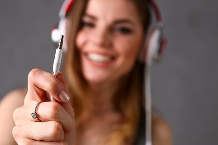 Beautiful blonde woman wearing headphonesの写真素材