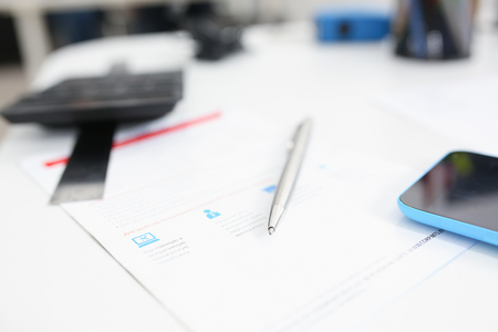 Group of people deliberate on problem with infographicsの写真素材