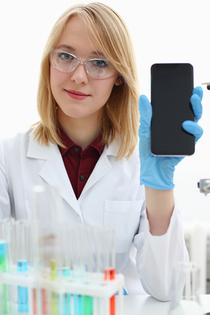 A female doctor in a chemical laboratory holdsの写真素材