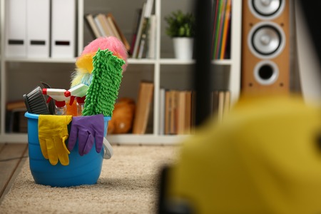 A bucket with cleaning equipment standsの写真素材
