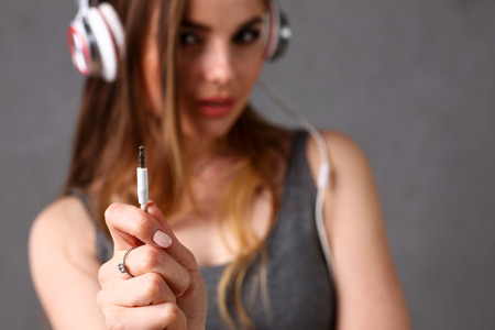 Beautiful blonde woman wearing headphonesの写真素材