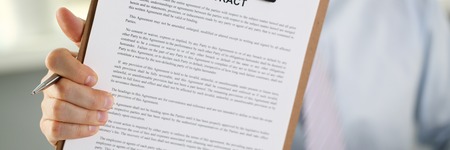 Male arm in suit offer contract form onの写真素材