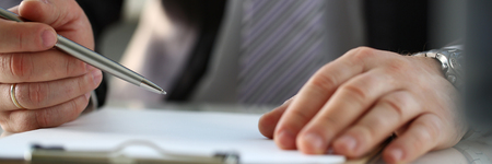 Male arm in suit and tie fill form clipped to padの写真素材