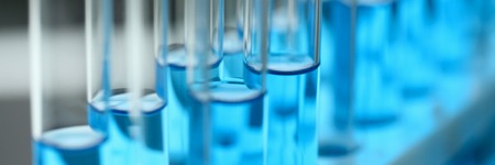 Test tube of glass overflows liquid solution potassium