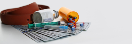 Money dollars used syringe pills and unknownの写真素材