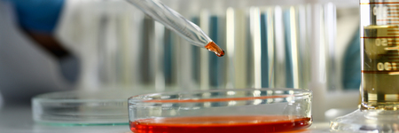 Yellow liquid spilled petrol additive innovative supplyの写真素材