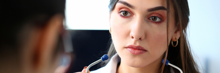 Female doctor hands holding stethoscope inの写真素材