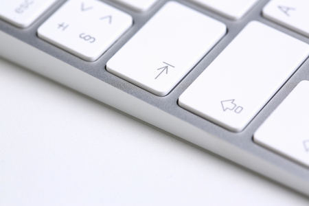 Silver keyboard with white key push button