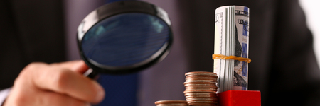 Hand businessman in suit hold quarterの写真素材