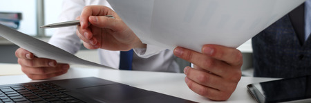 Group of people hold in arms financial papersの写真素材