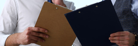 Group of people hold in arms financial papers
