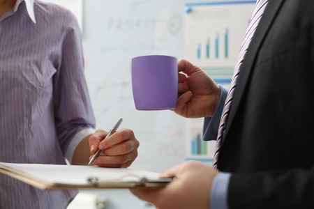 Female arm offer contract form on clipboard padの写真素材