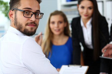 Handsome smiling bearded clerk man wearing glassesの写真素材