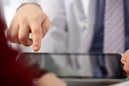 Female doctor hands hold and show digitalの写真素材