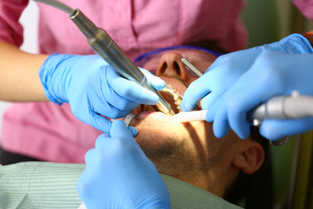 Female hand in blue protective glovesの写真素材