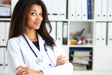Beautiful black smiling female doctor portraitの写真素材