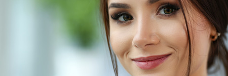 Beautiful smiling clerk girl wearing suit hold notebookの写真素材