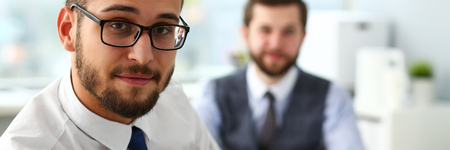 Group of smiling bearded businessmen in suit and tieの写真素材