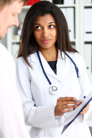 Female doctor hand hold silver pen and showingの写真素材