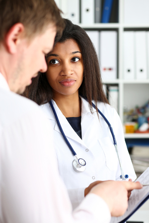 Female doctor hand hold silver pen and showingの写真素材