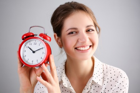 Adult smiling caucasian woman hold redの写真素材