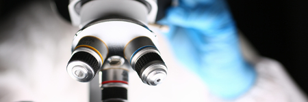 Male chemist in blue protective gloves lookの写真素材