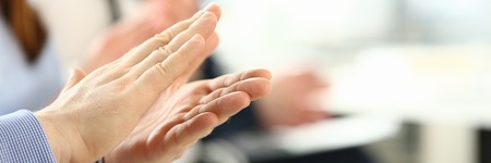 Group of people clap their arm in row during seminarの写真素材