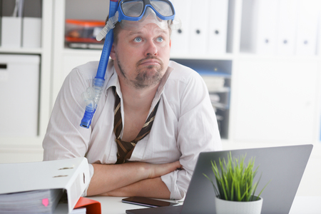 Man wearing suit and tie in goggles with snorkelの写真素材