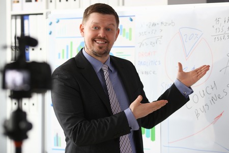 Male in suit and tie show stats graph padの写真素材